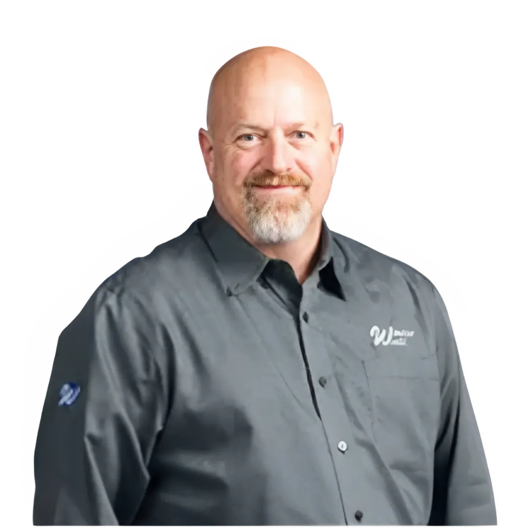 A bald man with a beard, wearing a grey collared shirt with a "Window World" logo, smiles confidently against a transparent background